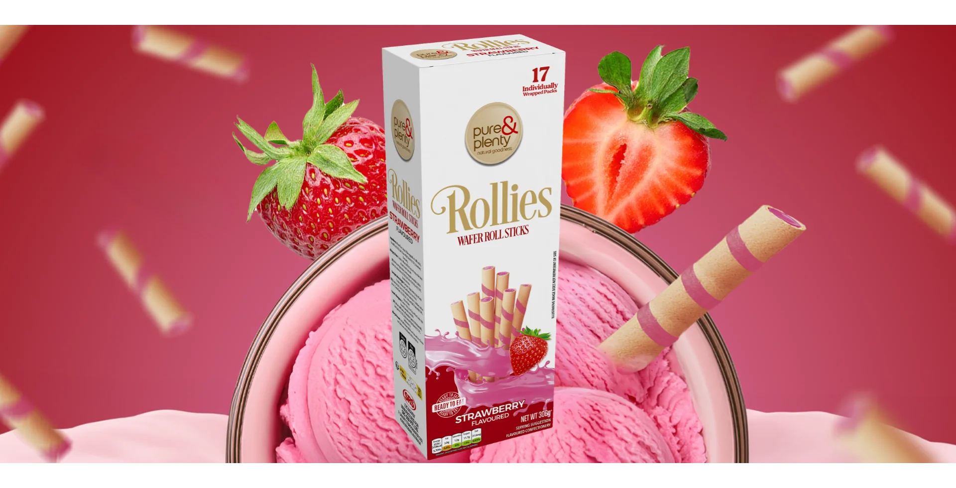 A box of Pure & Plenty Rollies Wafer Roll Sticks (Strawberry flavoured) with an indulgent bowl of pink strawberry ice cream and fresh strawberries.